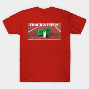 Track and field written above green starting blocks on a red track T-Shirt